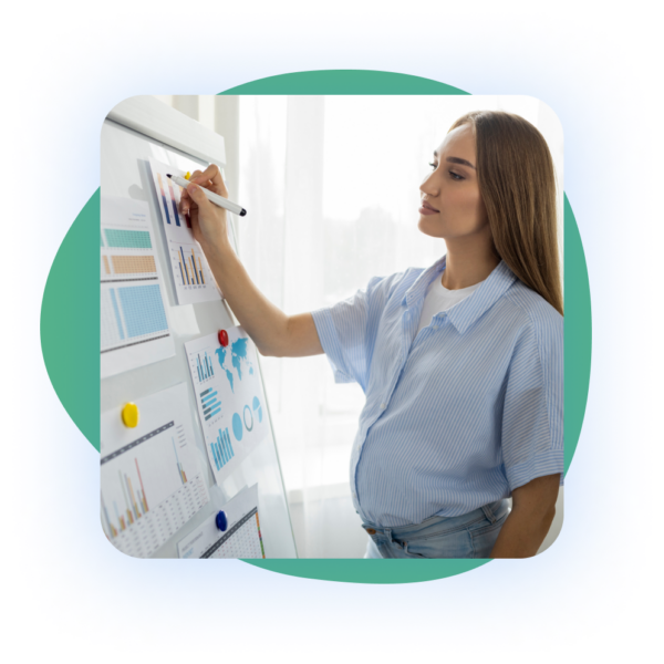 A pregnant woman in a blue striped shirt presenting data on a whiteboard with various charts and graphs.